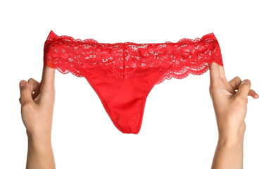 Female hands with sexy red panties on white background, closeup - obrazy, fototapety, plakaty