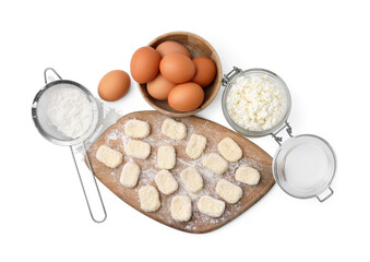Making lazy dumplings. Wooden board with cut dough and ingredients isolated on white, top view
