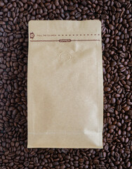 Bag of roasted coffee beans with empty space on a rich dark coffee background - 688304417