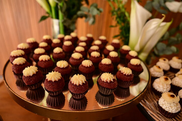 brigadeiros, chocolate balls, brazilian sweets, box of chocolate candies, chocolate candies on a plate, box of chocolates, birthday party, candy store, shop window

