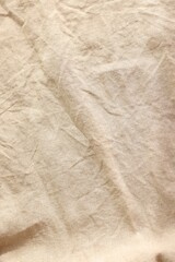 Beautiful beige fabric as background, top view