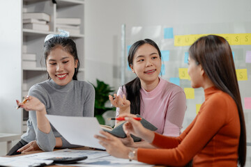 Attractive businesswoman heads strategy meeting in board room, Happy different aged business team having fun on office meeting, talking, laughing, brainstorming at conference table.