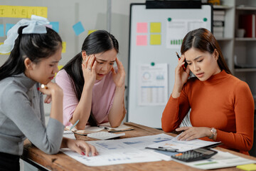 Frustrated upset multiracial business team people sad with bad work result in report disappointed in corporate bankruptcy failure crisis worried of paperwork problem sit at table at office meeting..