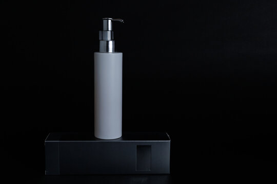 Blank skin care porduct and its box isolated on black