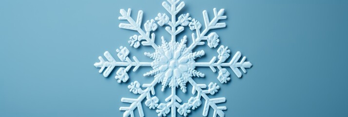 A Serene Winter's Embrace: The Elegance of a Single Simplistic White Snowflake Against a Calming Pastel Blue Backdrop, Symbolizing the Unique Beauty of Nature's Artistry