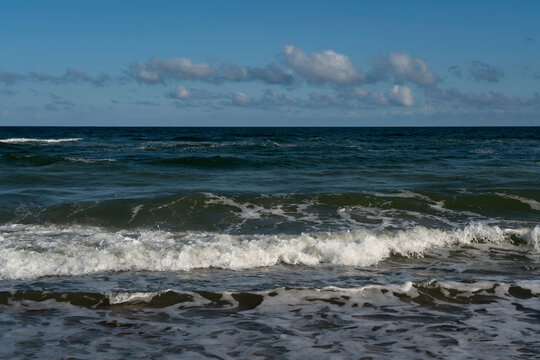View of the incoming wave on the Baltic Sea on the shore of the Curonian Spit on a summer day,