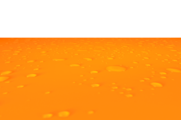 Orange juice splash. Red water with ripples on the surface. Defocus blurred transparent gold colored clear calm water surface texture with splashes and bubbles. Water waves with shining pattern.