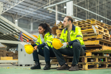 Cardboard workers chat, share ideas during breaks, foster togetherness, create positive workspace.