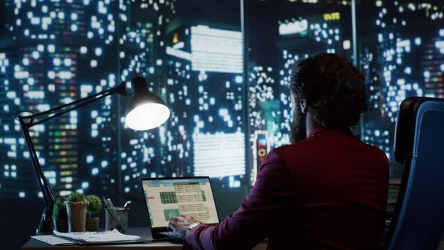 Qualified director studying worldwide economy in order to negotiate assets in financing and boost global legitimate earnings. Expert working late at night to provide required funds.
