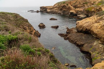 Naklejka na ściany i meble Rocks in the ocean. CA, USA