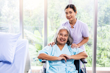 Portrait of young doctor or nurse and elderly patient pensioner on appointment at clinic or...