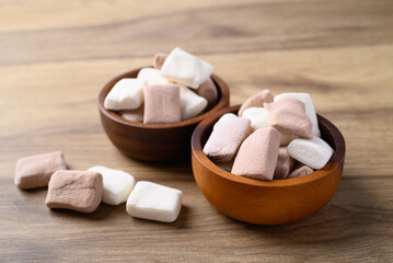 Marshmallow chocolate and vanilla in bowl on wooden background