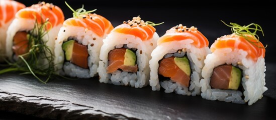 Sushi rolls with salmon, cream cheese, avocado, and nori.