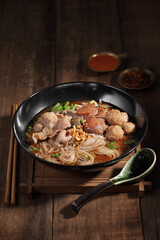 Chinese beef noodle soup. Taiwanese beef noodle on wooden background.