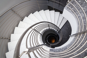 spiral staircase with steps in gray tones - obrazy, fototapety, plakaty