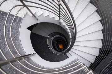 spiral staircase with steps in gray tones