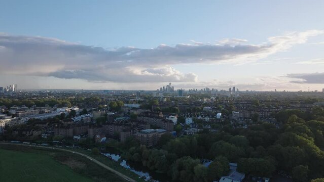 Wide rising aerial shot of the London skyline from Clapton city suburbs