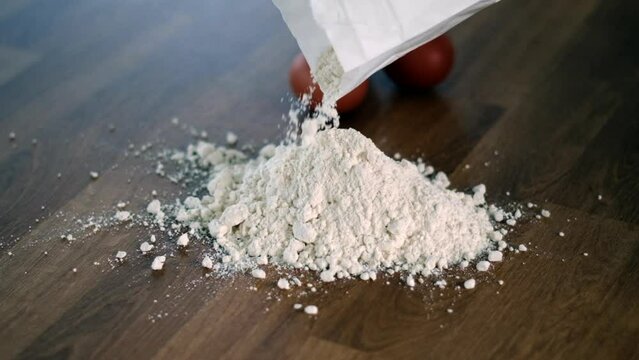 Pouring Flour on Wooden Table for Baking Preparation. Homemade Pasta Eggs Ready