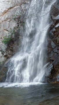 Sturtevant Falls in the San Gabriel Mountains - Los Angeles National Forest, waterfall on Santa Anita Creek, near Altadena and Pasadena in Southern California. Time lapse, seamless loop vertical video