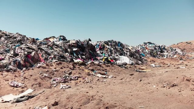 Accumulation of second-hand clothes in clandestine landfill generating a garbage dump in the Chilean desert
