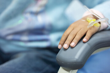 Close up of child's hand infusion