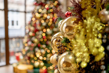 Golden and red sparkling balls on a Christmas tree