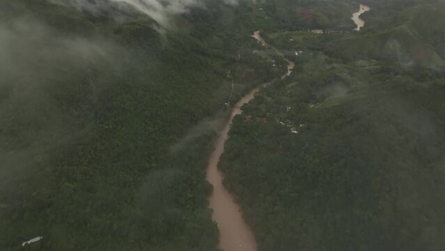 Flying through clouds at Semuc champey the Cahabon river Guatemala, aerial