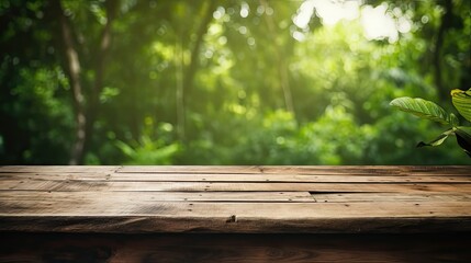 Empty old wooden table with green nature background