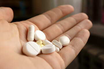 a handful of pills in hands