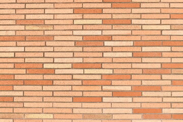 Brightly colored brick wall with red colors.