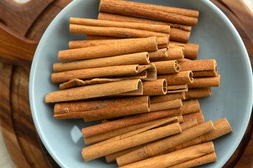 cinnamon sticks on a plate, top view