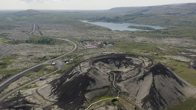 Aerial Video pulling out atop the great Grabrok volcano crater which lies dormant in the west of Iceland