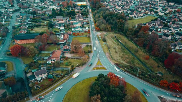 Timelapse of a roundabout and its busy traffic located in a the town of Thetford, in Breckland, Norfolk, in United Kingdom.