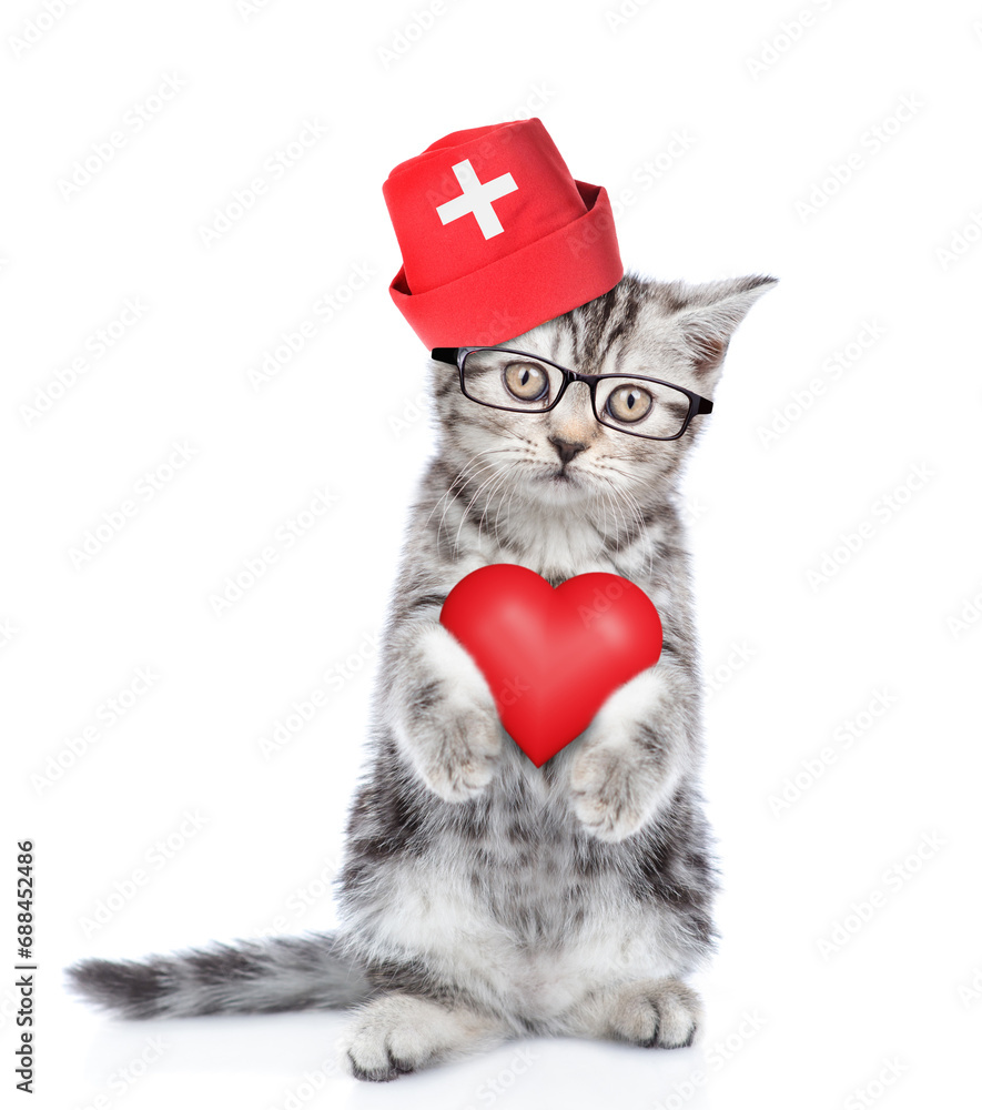 Sticker Smart kitten wearing like a doctor standing on hind legs and holds red heart. isolated on white background