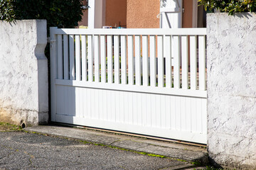 white sliding home door aluminum gate slide slats portal garden entry suburb house