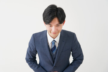 お辞儀するビジネスマン　白背景