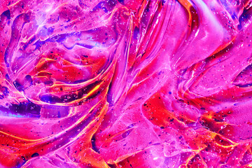 Abstract holographic neon magenta pink, purple, red, orange cosmetic gel serum background texture....