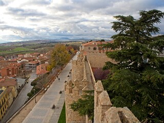 Fototapeta na wymiar To the north of Madrid sits the rustic city of Ávila. Medieval walls surround the preserved 16th-century town.