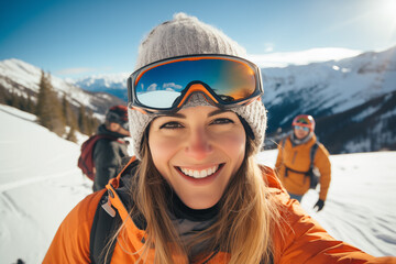 Winter sport smiling young woman selfie portrait against snowy mountains landscape - obrazy, fototapety, plakaty