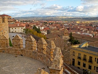 Naklejka premium To the north of Madrid sits the rustic city of Ávila. Medieval walls surround the preserved 16th-century town.