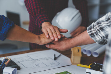 stack hands of business engineering and architect teamwork join together, construction engineer...