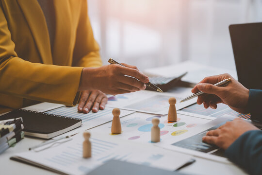 Business planning for marketing work, placing people, allocating employees in each department to work. with project planning documents on the conference table Human resources management concept.