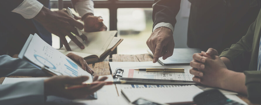 Business teams meet to discuss business, brainstorm ideas, analyze reports from growth reports, graphs, charts showing financial projects. Check investment results and profits of the company.