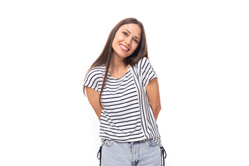 Obraz premium young beautiful caucasian brunette woman in a striped sweater with short sleeves on a white background with copy space
