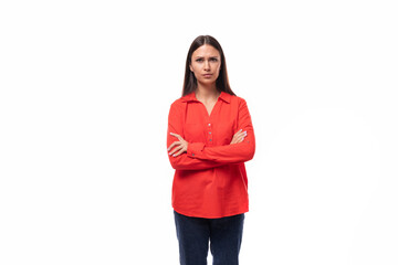 young pretty brunette office worker woman dressed in a red loose shirt on a white background