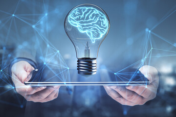 Brain shaped lightbulb on digital interface background. Innovation and mind concept