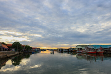 many fishing boats are moored at Pak Nam Rayong in the morning.