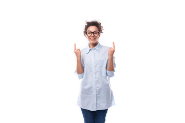 young successful confident leader woman with curly black hair dressed with light blue shirt