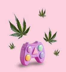 Game console joystick and marijuana leaves flying around. Minimal art poster. Mind relaxation concept. Play and smoke.