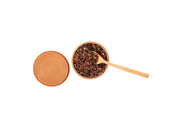 Crunchy pieces of peeled, crushed and lightly roasted cocoa beans with pleasant chocolate bitterness in wooden bowl with spoon, top view. Cacao nibs. Sugar-free product